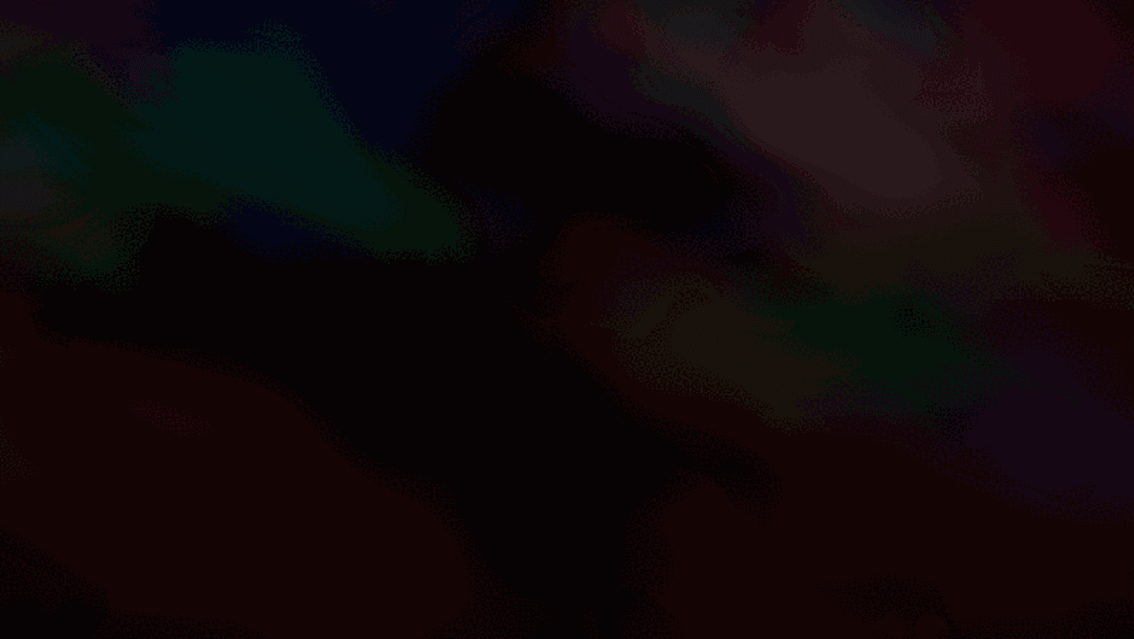 Abstract green, purple and red light on a dark background